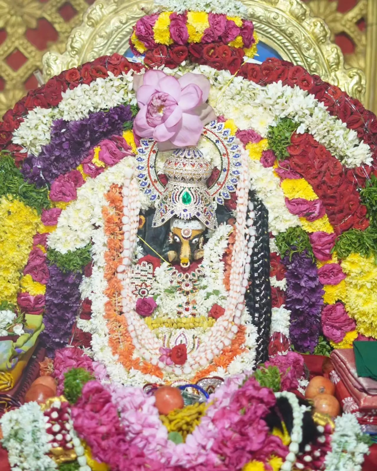 Deity with floral decorations